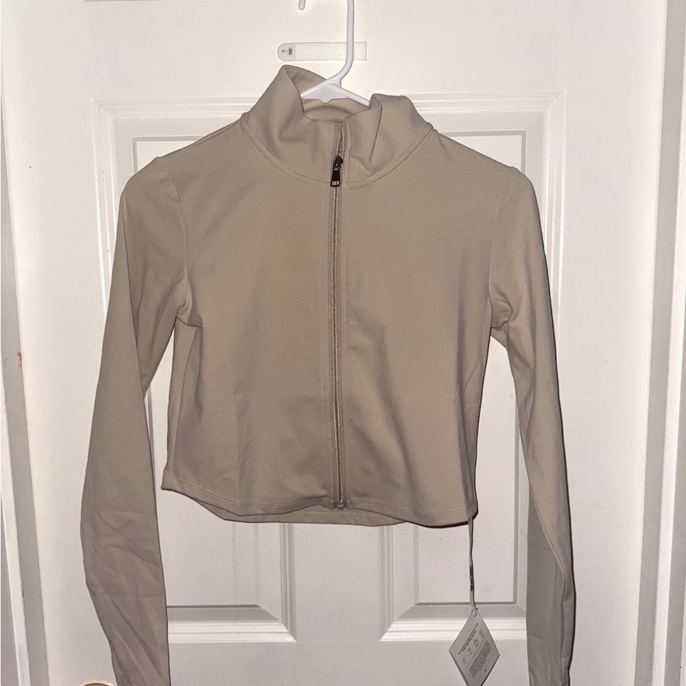 Acta Wear cropped jacket! Color is tan/ beige. Size small- never worn